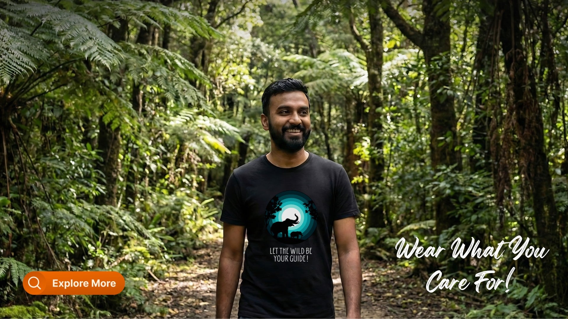 Man wearing a black t-shirt with a graphic design in a forest setting